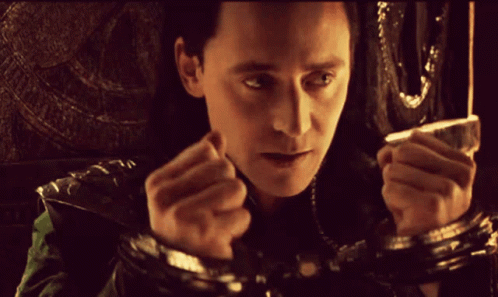 A Close Up Of A Man 'S Face With His Hands Behind His Back GIF