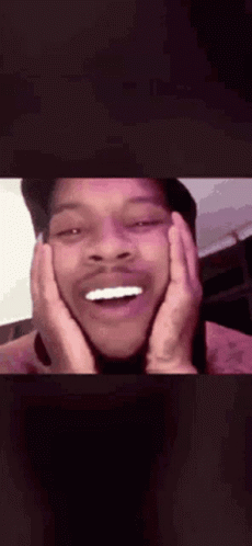 A Close Up Of A Man 'S Face With His Hands On His Face And His Mouth Open . GIF