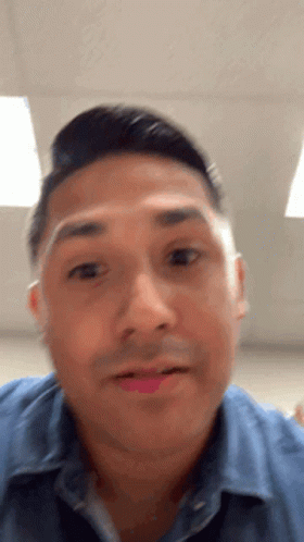 A Close Up Of A Man 'S Face With His Mouth Open GIF