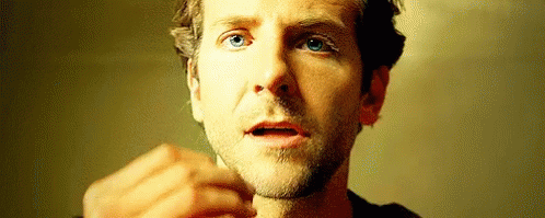 A Close Up Of A Man 'S Face With His Mouth Open And A Beard . GIF