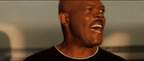 A Close Up Of A Man 'S Face With His Mouth Open And A Mustache . GIF