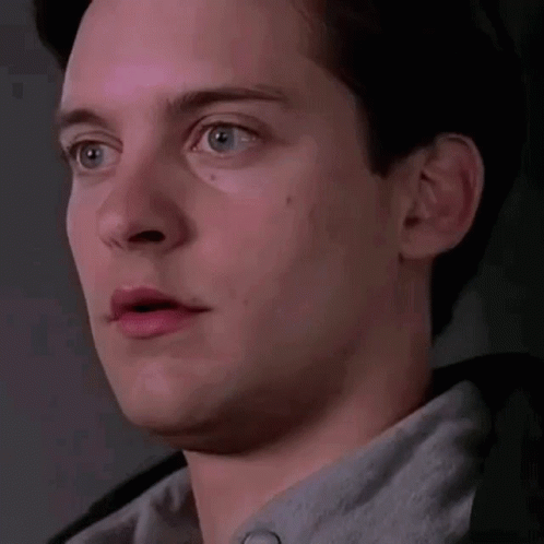 A Close Up Of A Man 'S Face With His Mouth Open And A Surprised Look On His Face . GIF