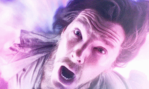 A Close Up Of A Man 'S Face With His Mouth Open And A Surprised Look On His Face . GIF