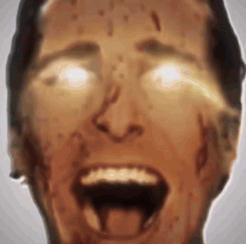 A Close Up Of A Man 'S Face With His Mouth Open And Blood Coming Out Of His Mouth . GIF