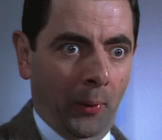 A Close Up Of A Man 'S Face With His Mouth Open And His Eyes Wide Open . GIF