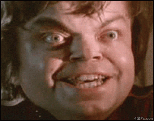 A Close Up Of A Man 'S Face With His Mouth Open And His Teeth Visible GIF