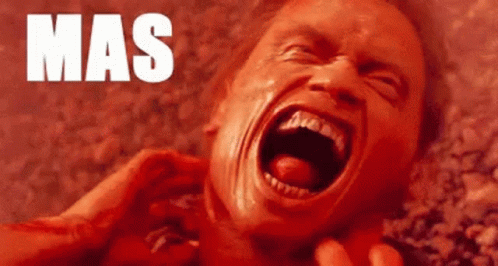 A Close Up Of A Man 'S Face With His Mouth Open And The Word Mas Written On The Bottom . GIF