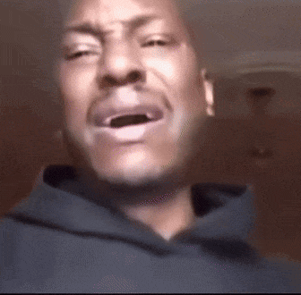 A Close Up Of A Man 'S Face With His Mouth Open GIF