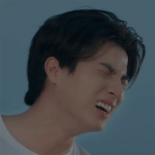 A Close Up Of A Man 'S Face With His Mouth Open GIF