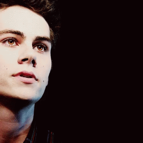 A Close Up Of A Man 'S Face With His Mouth Open GIF