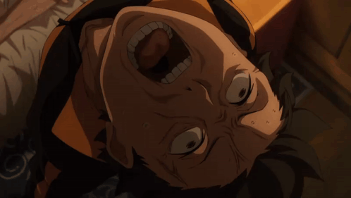 A Close Up Of A Man 'S Face With His Mouth Open GIF
