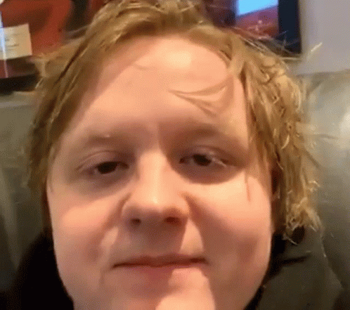 A Close Up Of A Man 'S Face With His Mouth Open GIF