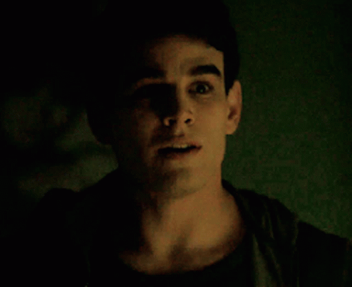 A Close Up Of A Man 'S Face With His Mouth Open GIF