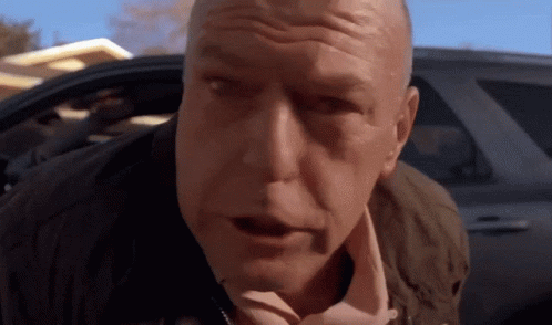 A Close Up Of A Man 'S Face With His Mouth Open GIF