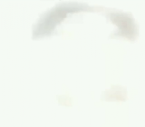 A Close Up Of A Man 'S Face With His Tongue Hanging Out . GIF