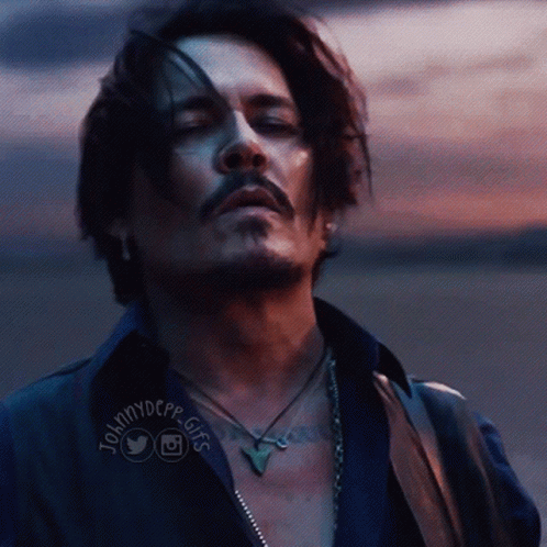 A Close Up Of A Man 'S Face With Johnnydepp Gifs On The Bottom Right GIF