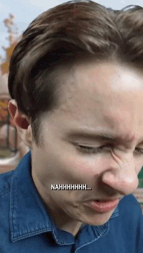 A Close Up Of A Man 'S Face With Nahhhhhhh Written On The Bottom Right GIF