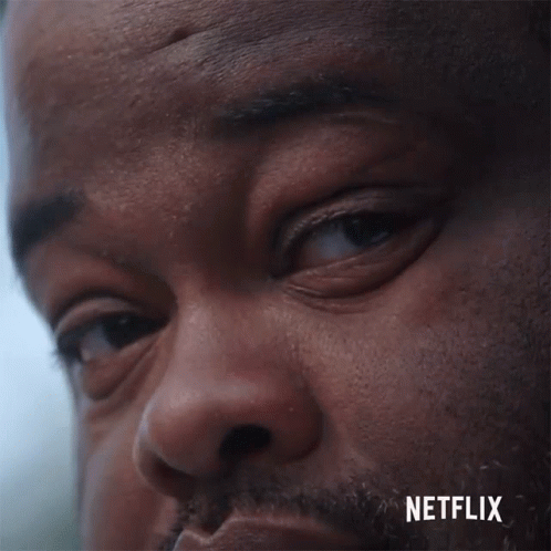 a close up of a man 's face with netflix written on the bottom right