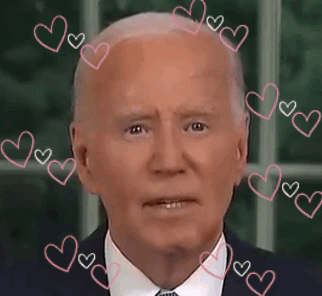 A Close Up Of A Man 'S Face With Pink Hearts Around It GIF