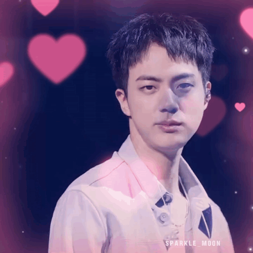 A Close Up Of A Man 'S Face With Pink Hearts Behind Him And The Words Sparkle Moon On The Bottom GIF