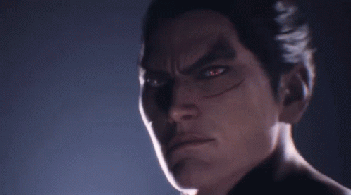 A Close Up Of A Man 'S Face With Red Eyes Looking At The Camera GIF