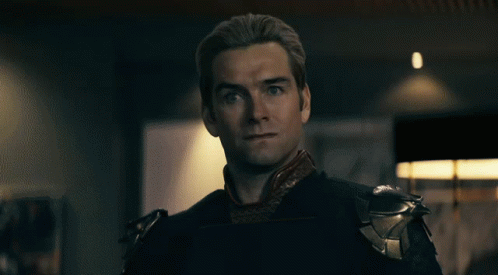A Close Up Of A Man 'S Face With Red Eyes Looking At The Camera GIF