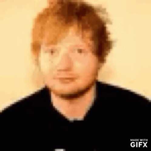 A Close Up Of A Man 'S Face With Red Hair . GIF