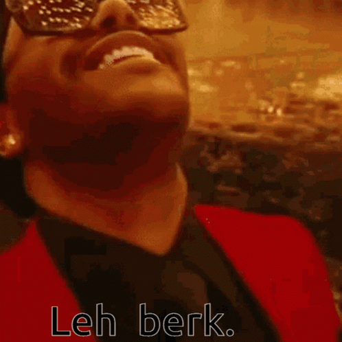 A Close Up Of A Man 'S Face With Sunglasses On And The Words Leh Berk Written On The Bottom . GIF