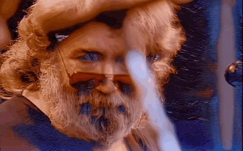 A Close Up Of A Man 'S Face With Sunglasses On GIF