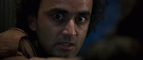 A Close Up Of A Man 'S Face With Sweat Coming Out Of His Face GIF