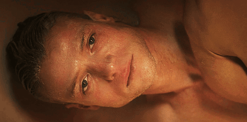 A Close Up Of A Man 'S Face With Sweat Coming Out Of It GIF