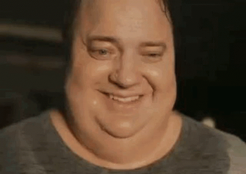 A Close Up Of A Man 'S Face With Sweat On His Face And A Smile . GIF