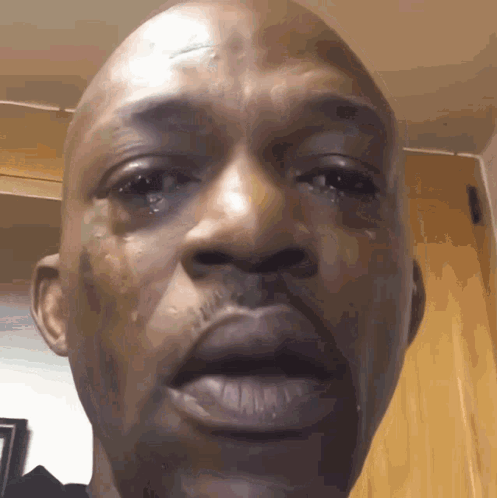 A Close Up Of A Man 'S Face With Tears Running Down His Cheeks GIF