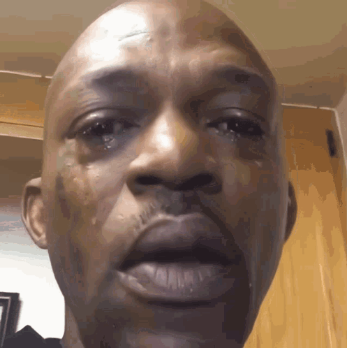 A Close Up Of A Man 'S Face With Tears Running Down His Cheeks GIF