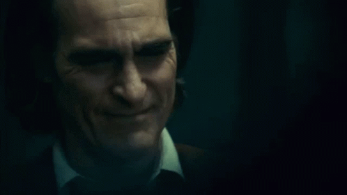Close Up Man Face With Tears In Dark Room GIF
