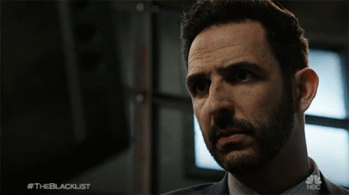 A Close Up Of A Man 'S Face With The Blacklist Written On The Bottom GIF