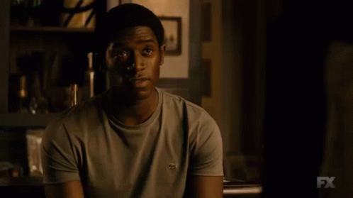 A Close Up Of A Man 'S Face With The Fx Logo Visible GIF