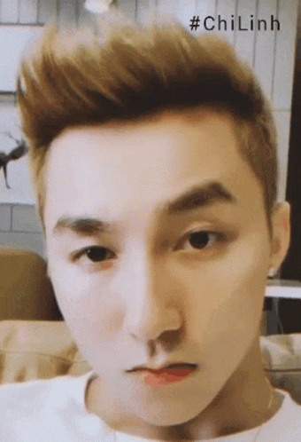 A Close Up Of A Man 'S Face With The Hashtag #Chilinh Written Above Him GIF