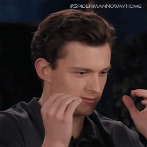 A Close Up Of A Man 'S Face With The Hashtag #Spidermannowwayhome Visible GIF