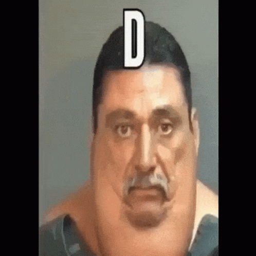 A Close Up Of A Man 'S Face With The Letter D On His Head . GIF