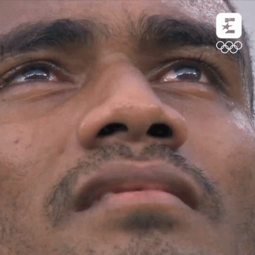 A Close Up Of A Man 'S Face With The Letters Lm On The Bottom Right GIF