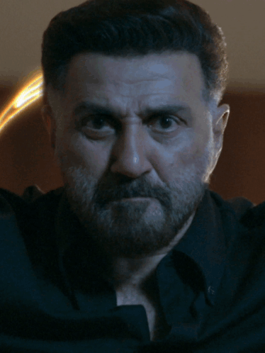A Close Up Of A Man 'S Face With The Letters St On The Bottom GIF