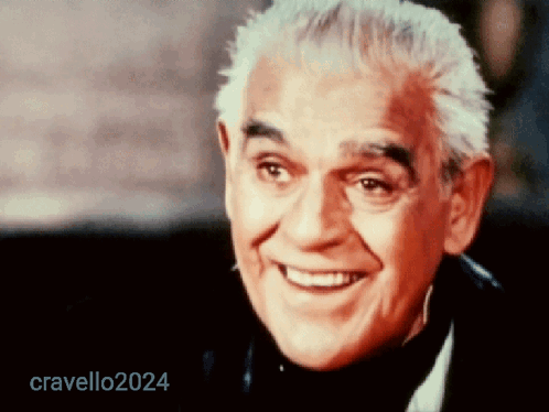 A Close Up Of A Man 'S Face With The Name Cravello2024 Visible GIF