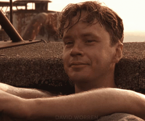 A Close Up Of A Man 'S Face With The Name David Worren On The Bottom Right GIF