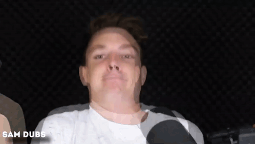 A Close Up Of A Man 'S Face With The Name Sam Dubs Written Below It GIF