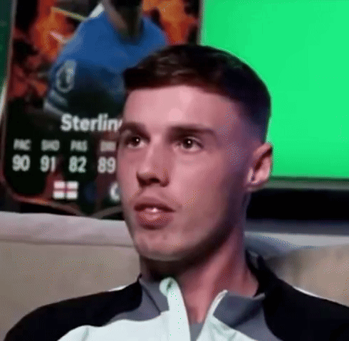 A Close Up Of A Man 'S Face With The Name Sterling On The Back GIF