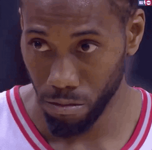A Close Up Of A Man 'S Face With The Nba Logo Visible GIF