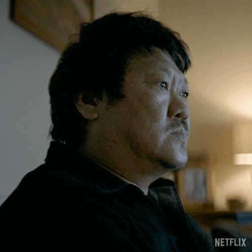 Close Up Of Man's Face With Netflix Logo GIF