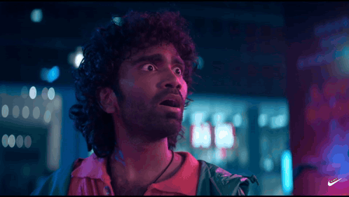 A Close Up Of A Man 'S Face With The Nike Logo In The Corner GIF