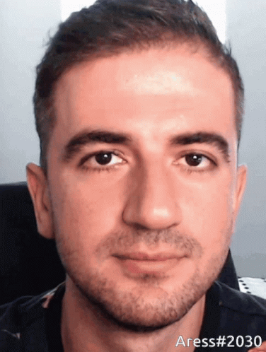 A Close Up Of A Man 'S Face With The Number 2030 On The Bottom GIF